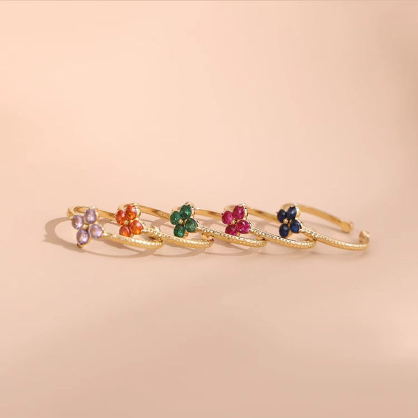 Ατσάλινο επιχρυσωμένο δαχτυλίδι με λουλούδι και χρωματιστά ζιργκόν