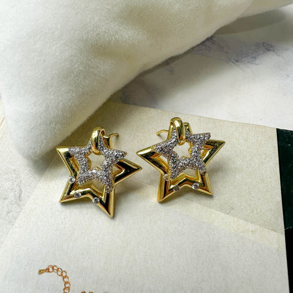 Χρυσά σκουλαρίκια αστέρια με λαμπερά ζιργκόν