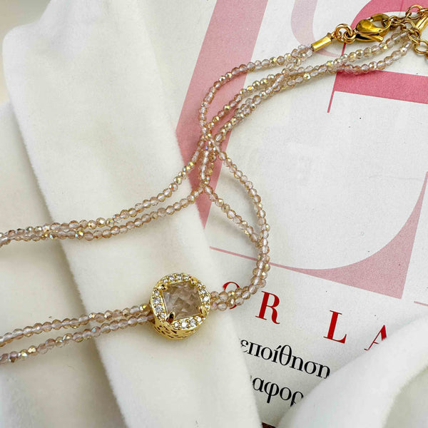 Διπλό κολιέ με κρυσταλλάκια και μενταγιόν με μπεζ κρύσταλλο και ζιργκόν