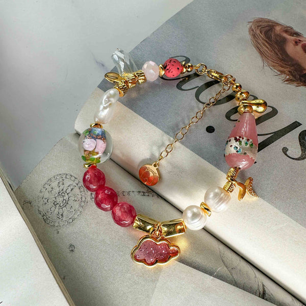 Βραχιόλι με μαργαριτάρια και mix ροζ στοιχεία pink cloud