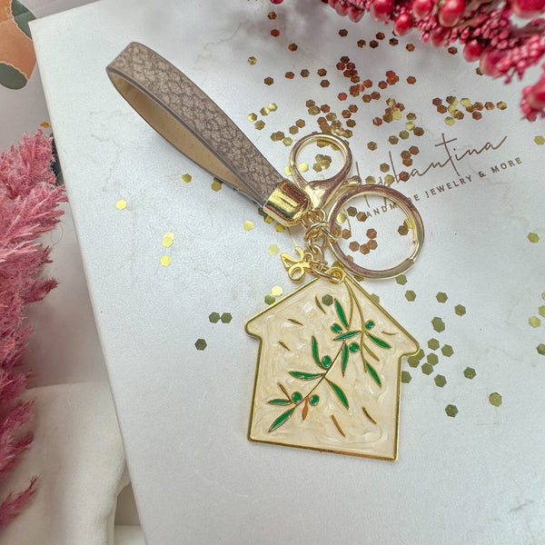 Γούρι Μπρελόκ Σπίτι σε Εκρού Απόχρωση με Κλαδί Ελιάς