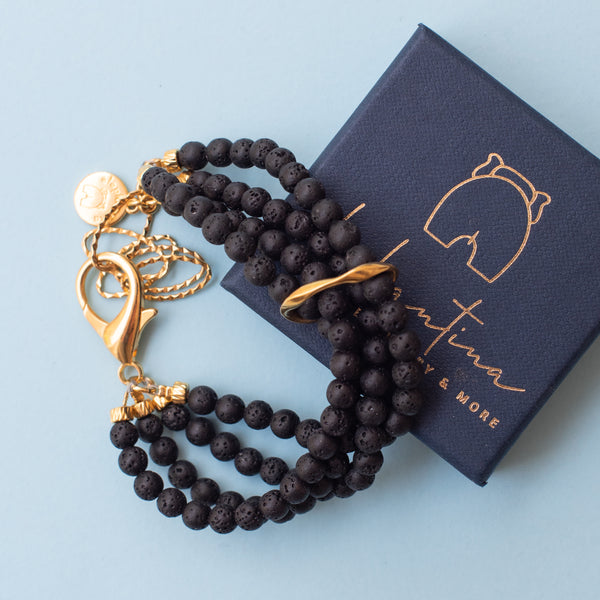 Βραχιόλι με ημιπολ. μαύρες πέτρες και επίχρυσο στοιχείο