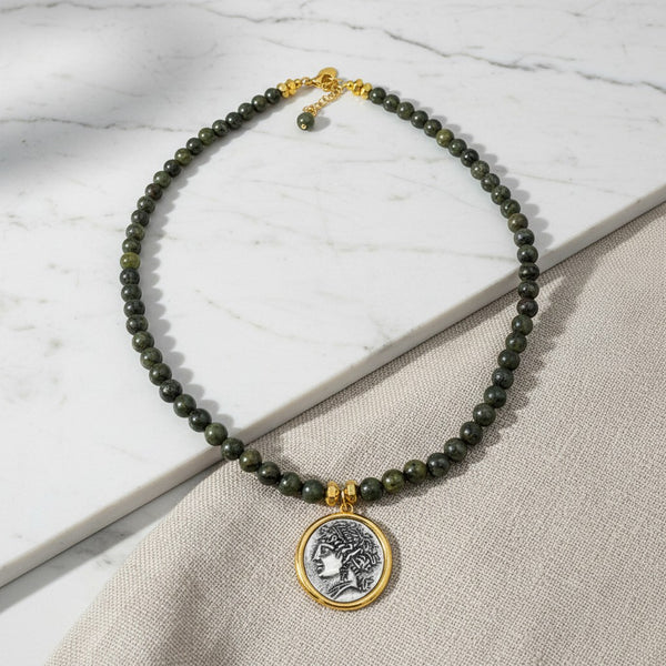 elephantina.gr Bahh necklace featuring dark green beaded stones and a gold-framed silver ancient coin pendant