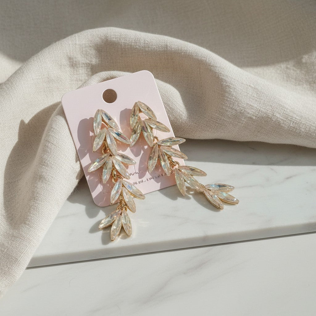 elephantina.gr gold-tone drop earrings featuring marquise-cut clear crystals in a delicate leaf-inspired design.