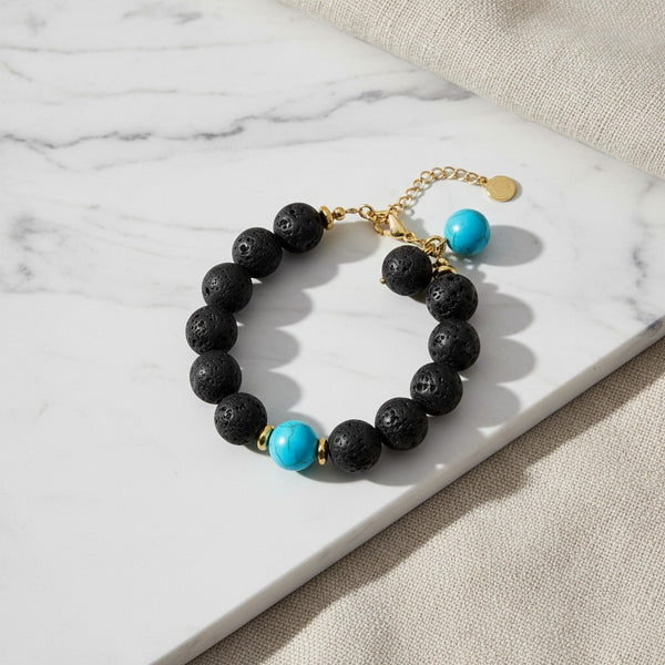 elephantina.gr beaded bracelet with black lava stone, turquoise accent beads, and gold-tone metal hardware