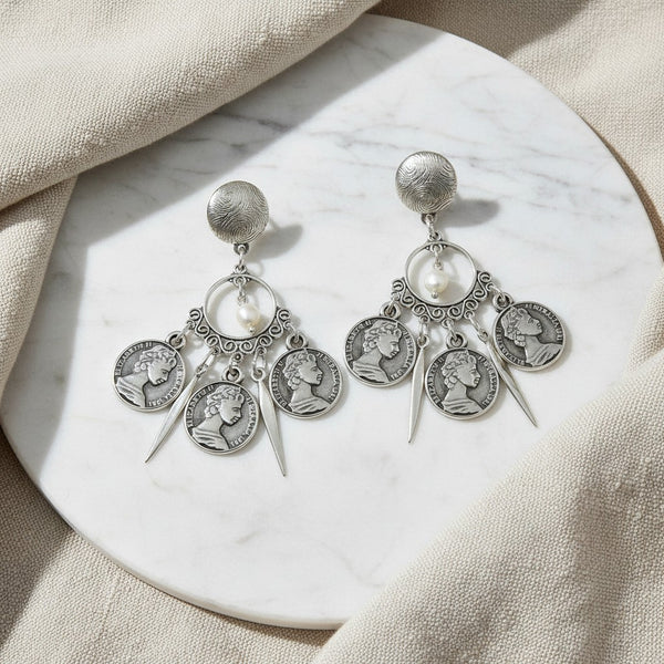 elephantina.gr silver coin drop earrings featuring Queen Elizabeth II profiles, pearl accents, and textured studs.