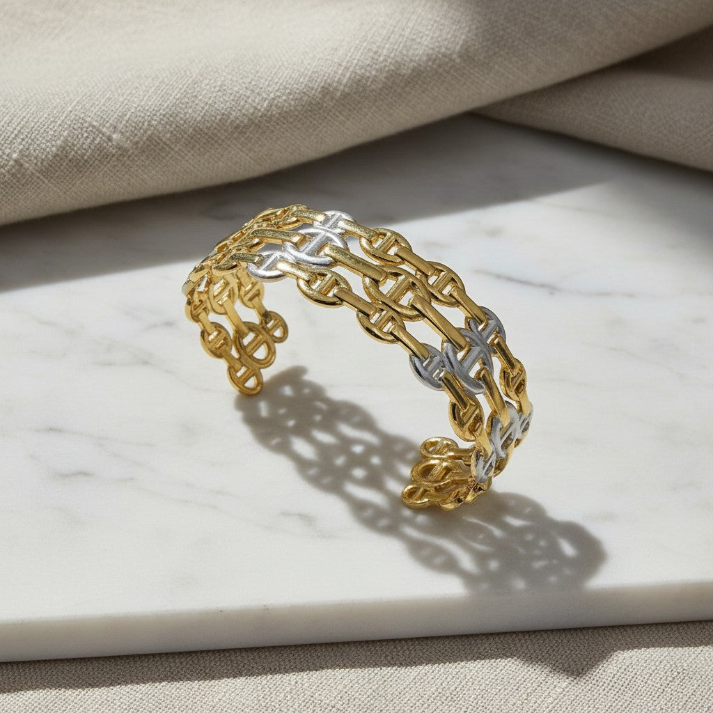elephantina.gr two-tone gold and silver chain link cuff bracelet on a marble surface