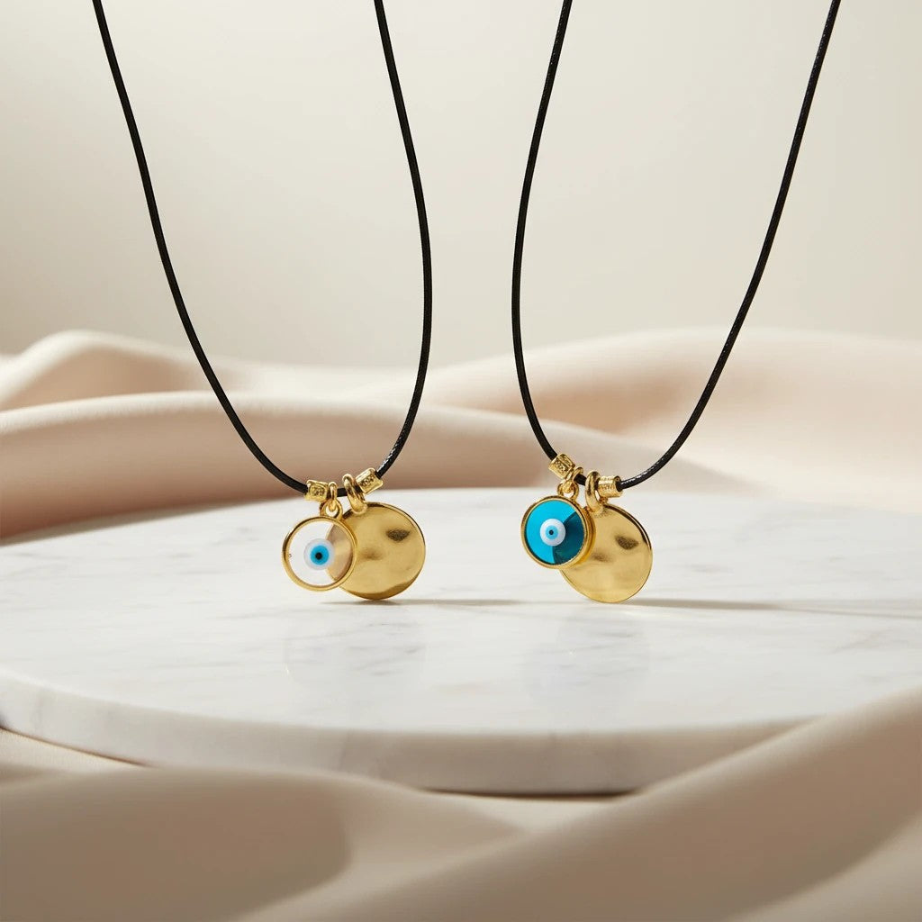elephantina.gr gold plated brass hammered disc and evil eye pendant necklace on black leather cord.