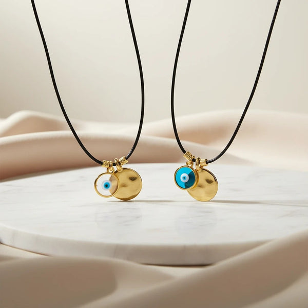 elephantina.gr gold plated brass hammered disc and evil eye pendant necklace on black leather cord.