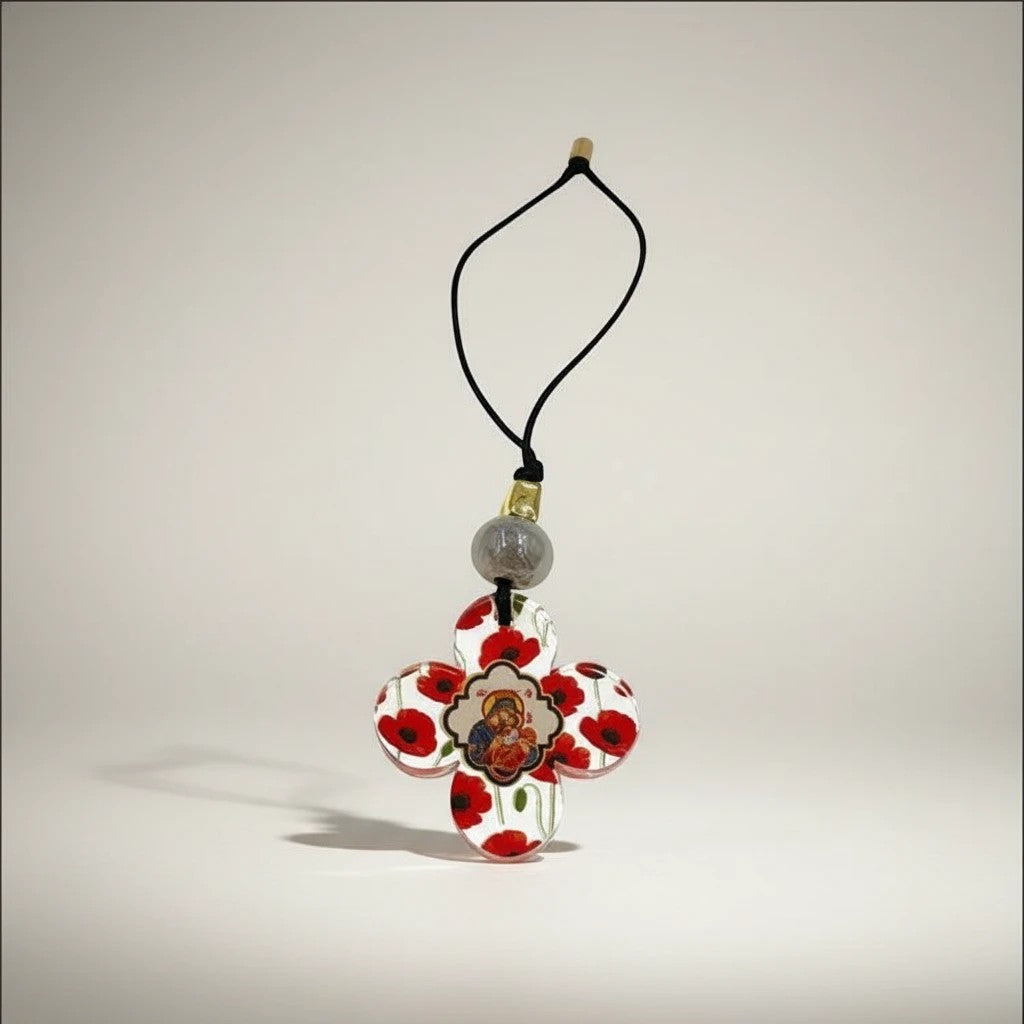 elephantina.gr religious cross ornament with red poppies and a central icon, hanging from a black cord with a grey bead.