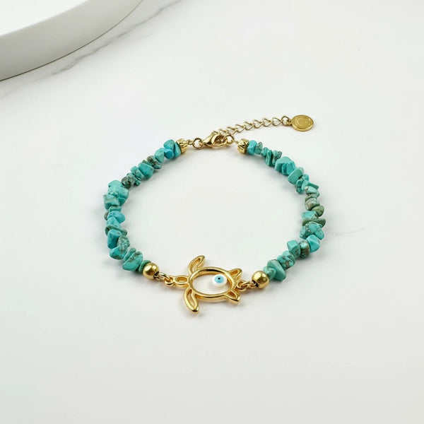 Elephantina.gr gold turtle anklet with turquoise chips and evil eye detail. Handmade jewelry.
