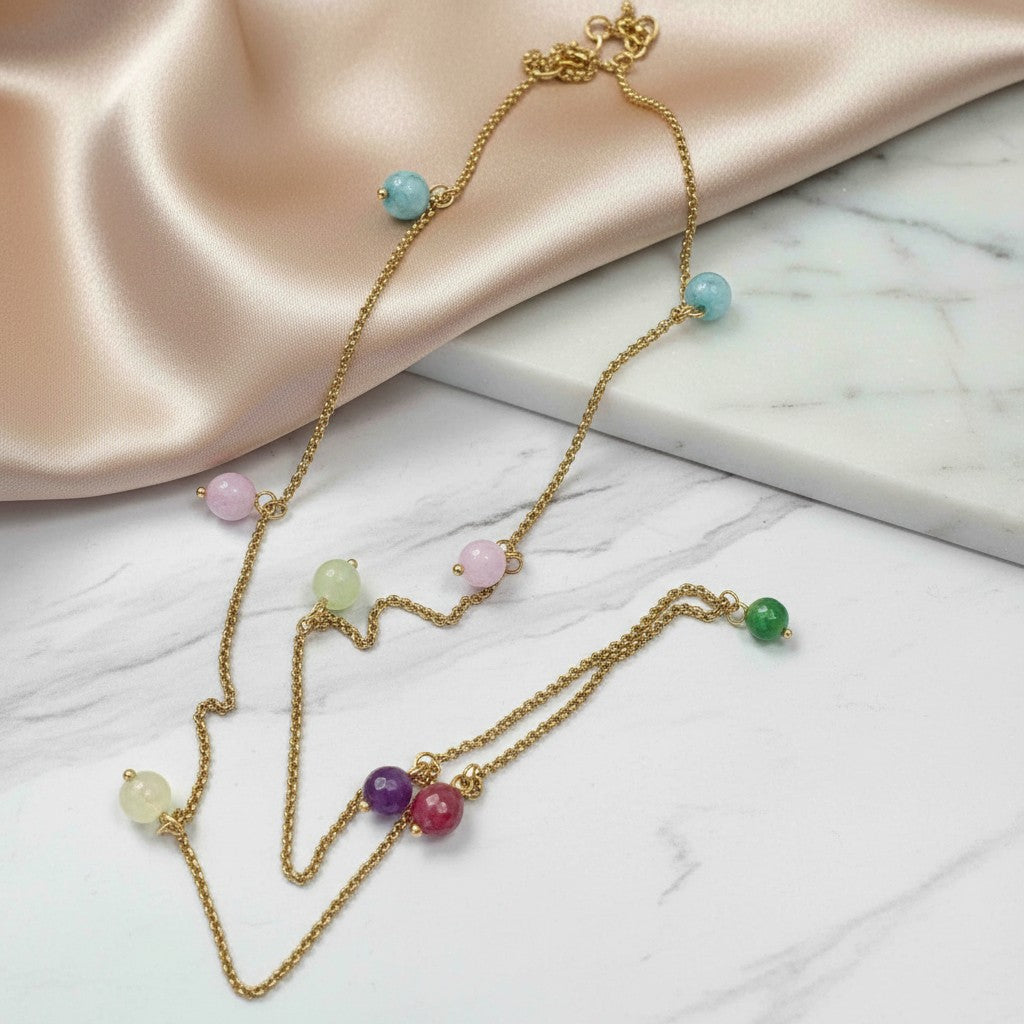 elephantina.gr gold chain necklace with colorful agate beads in pastel blue, pink, green, purple, and yellow. Delicate and elegant.
