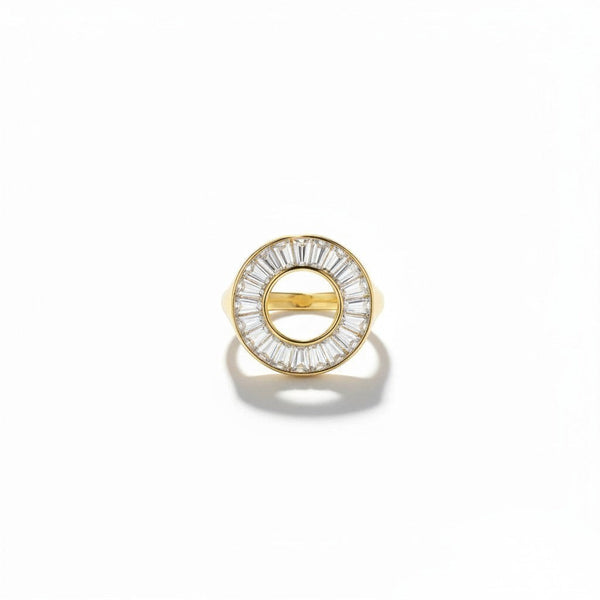 elephantina.gr gold-tone circular statement ring with a halo of baguette-cut clear crystals on a white background.