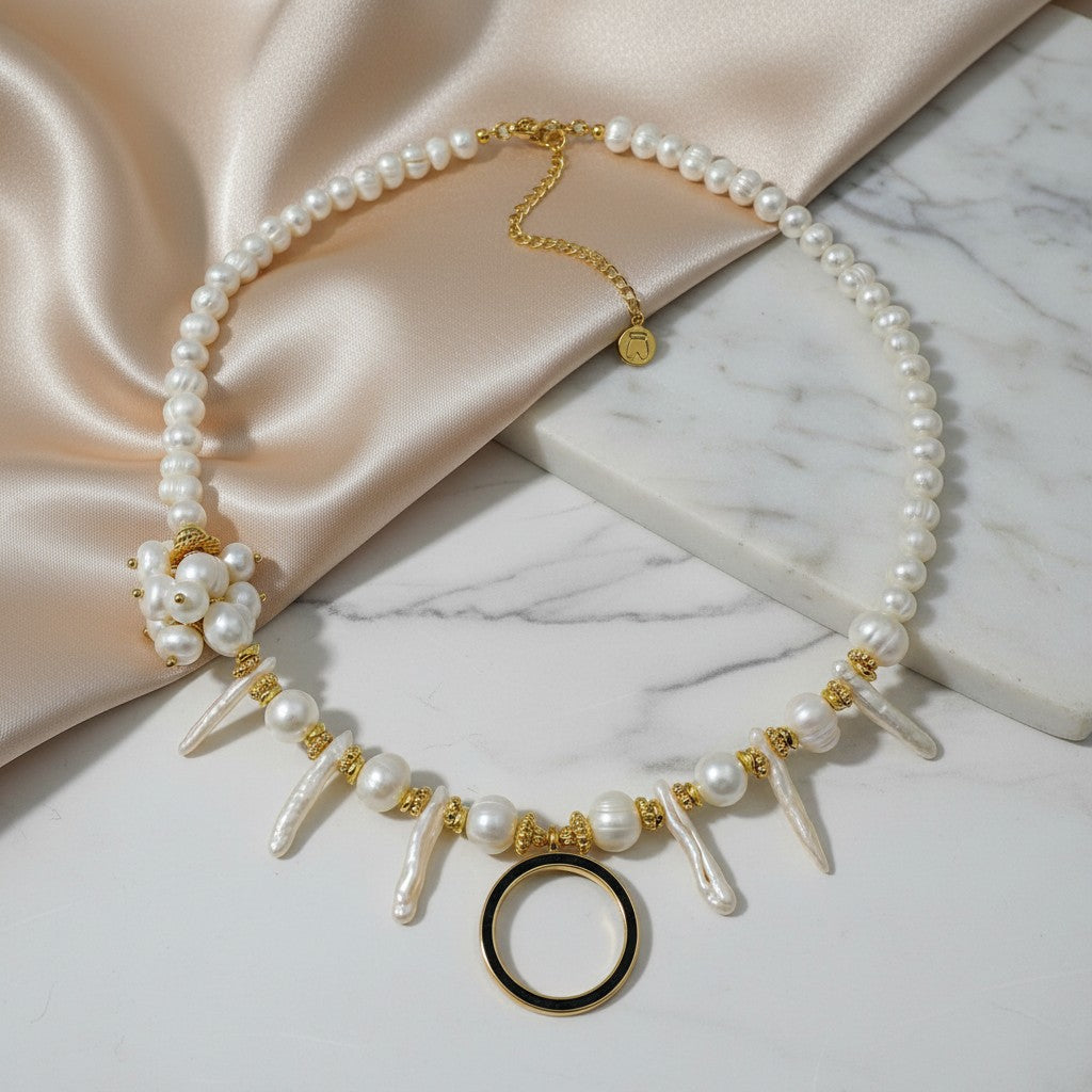 Elephantina.gr handmade necklace with ivory pearls, baroque elements, gold-tone circle, and floral pearl accent.