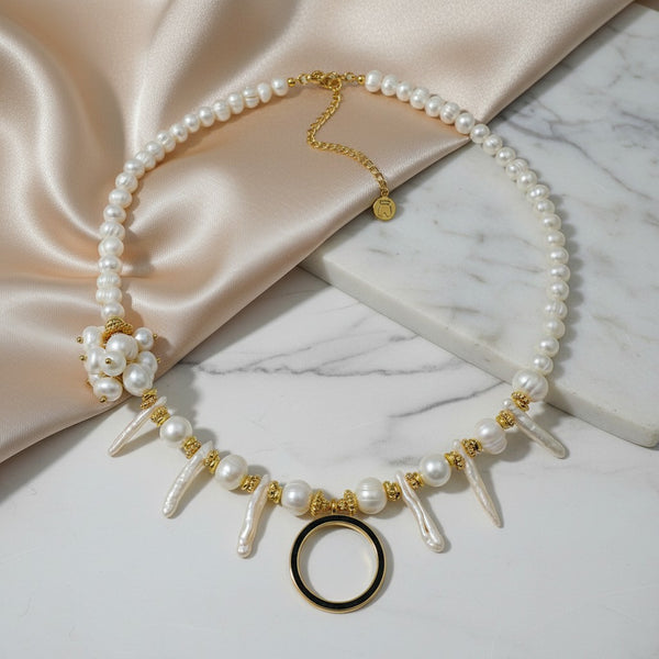 Elephantina.gr handmade necklace with ivory pearls, baroque elements, gold-tone circle, and floral pearl accent.