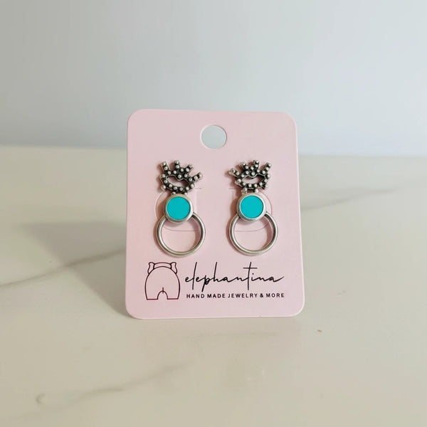 Handmade elephantina.gr silver-tone hoop earrings with turquoise inlay and decorative crown detail.
