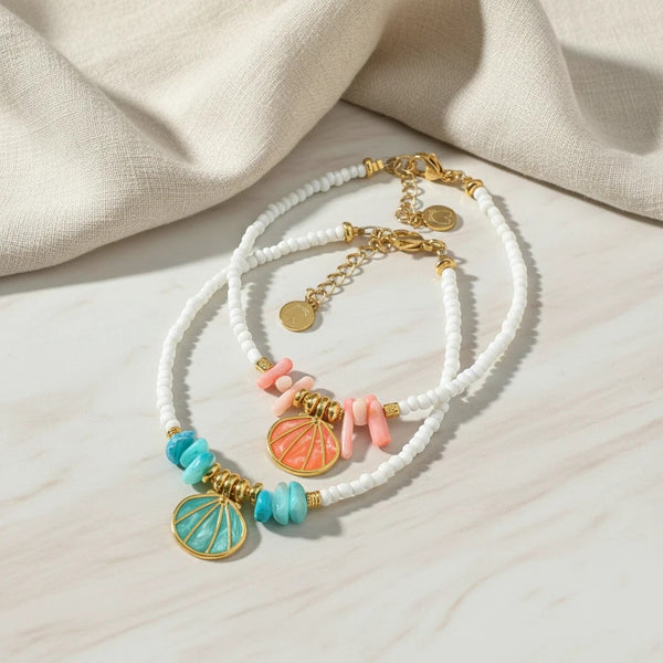 Elephantina.gr anklets with white beads, coral, turquoise stones, and gold shell charms. 24K gold plated.