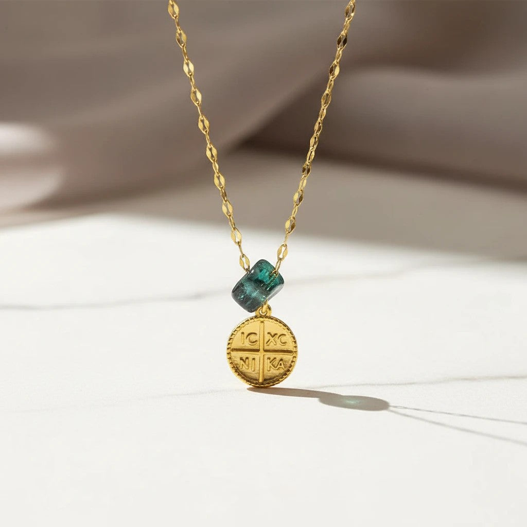Elephantina.gr gold plated stainless steel necklace with a dark blue stone and a Byzantine cross coin pendant.