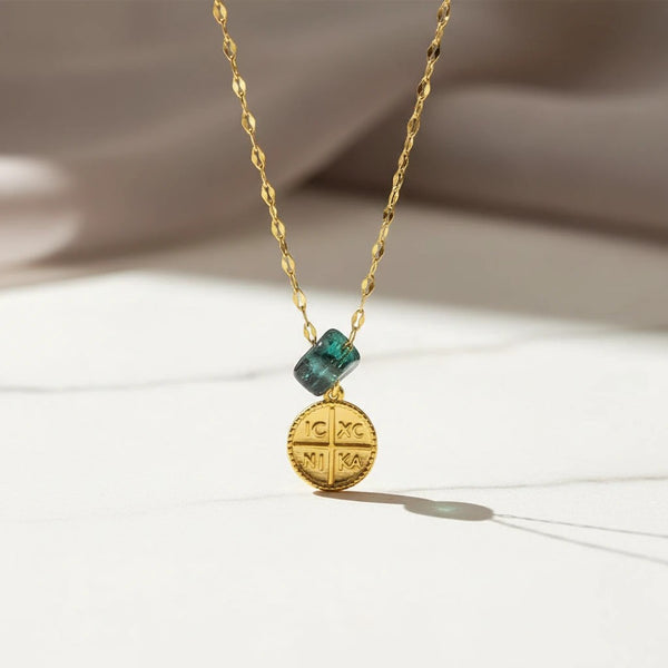 Elephantina.gr gold plated stainless steel necklace with a dark blue stone and a Byzantine cross coin pendant.
