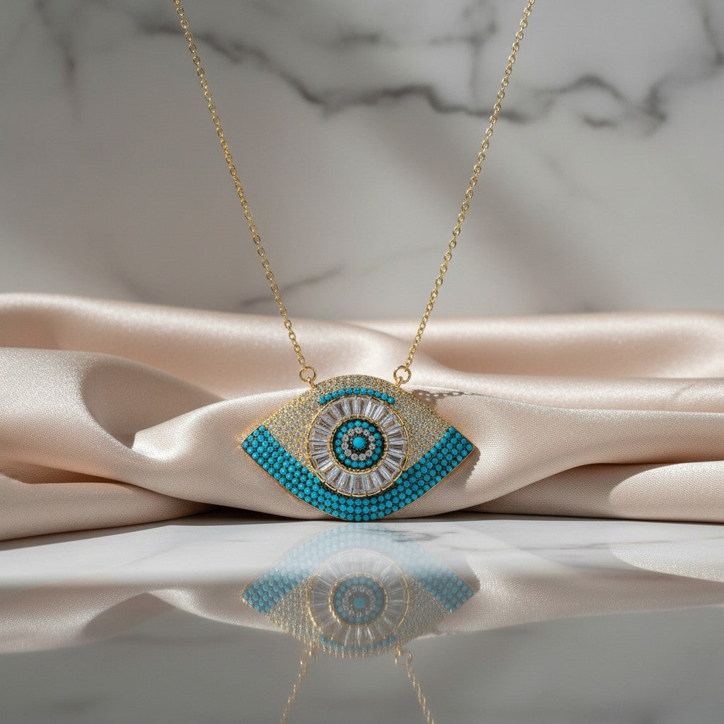 Elephantina.gr gold-plated steel chain necklace with evil eye pendant, white and blue zircons, and crystals.