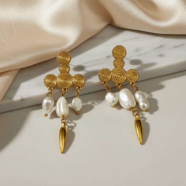 Elephantina.gr gold-plated chandelier earrings with baroque pearls and spiral detailing, featuring a gold spike charm.