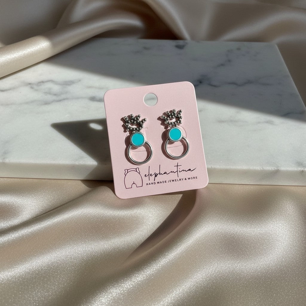 Handmade elephantina.gr silver-tone hoop earrings with turquoise inlay and intricate detailing.