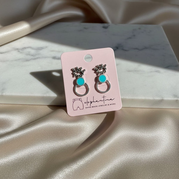 Handmade elephantina.gr silver-tone hoop earrings with turquoise inlay and intricate detailing.