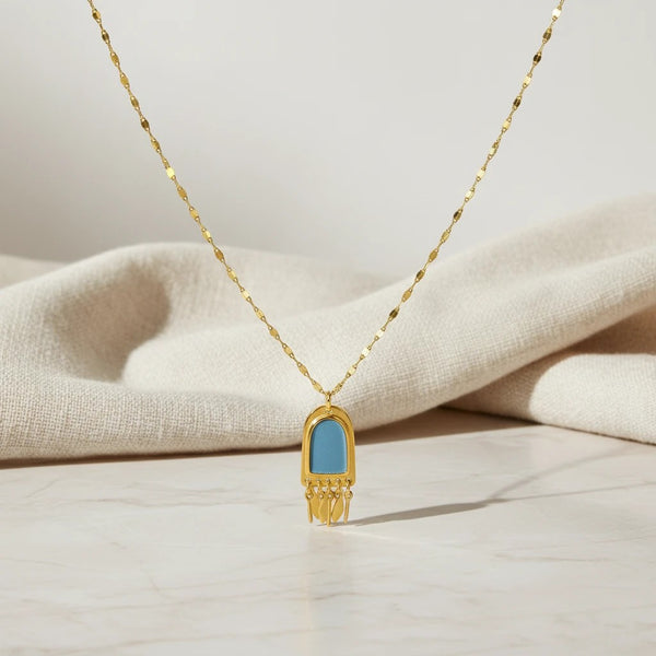 Elephantina.gr gold-tone stainless steel necklace with blue enamel pendant and dangling charms. 45cm + 5cm extension.
