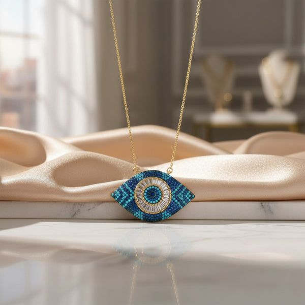 Elephantina.gr gold plated steel chain necklace with a blue evil eye pendant adorned with white and blue zircon and crystals.