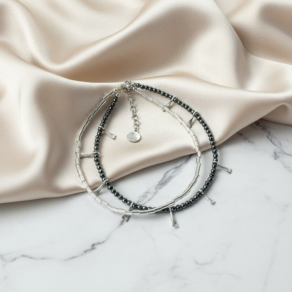 Elephantina.gr handmade anklet with silver hematite beads, gold brass elements, and glass beads. Minimalist boho style.