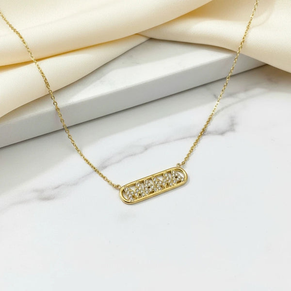 Gold plated stainless steel necklace with "MAMA" spelled out in cubic zirconia stones. Elegant and durable.