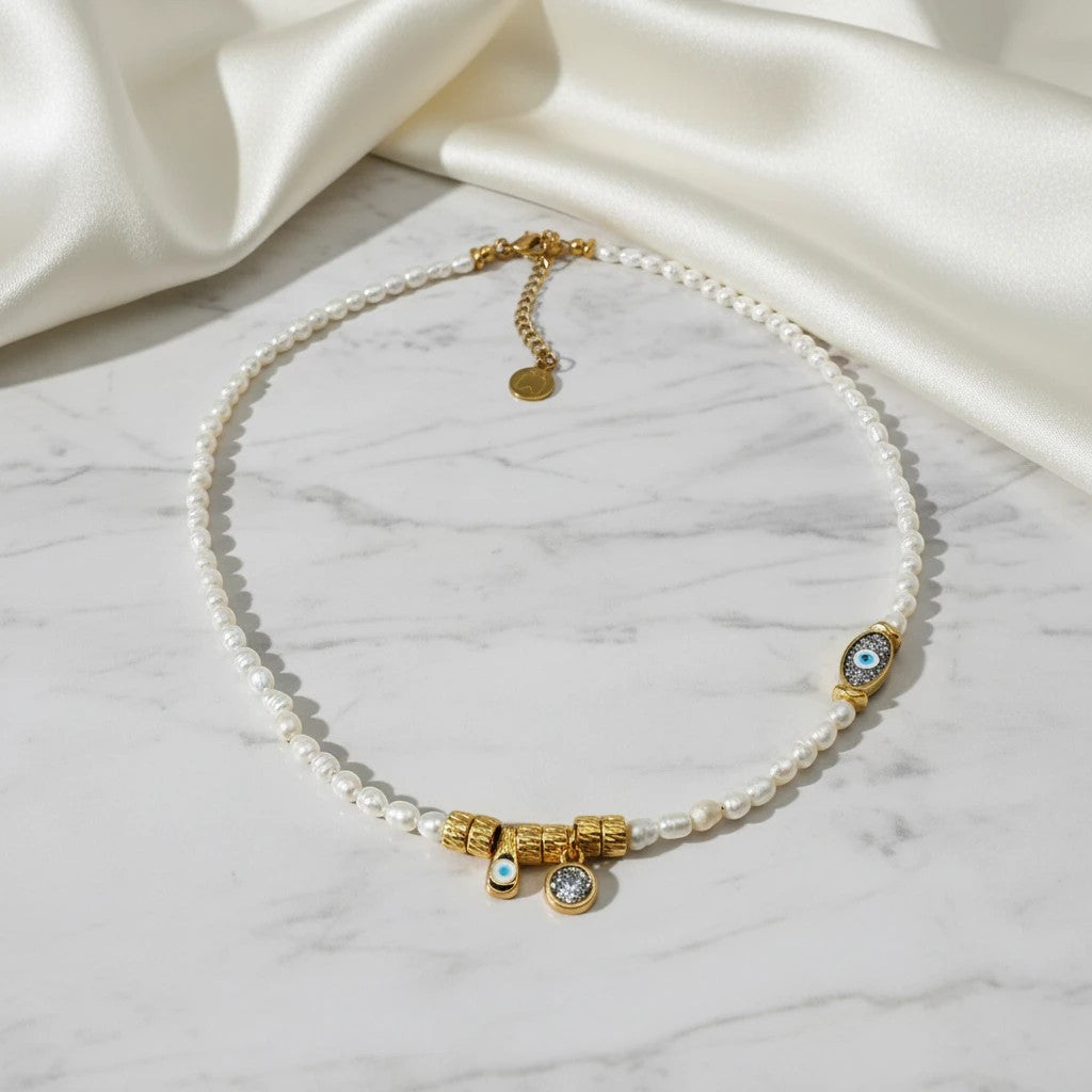 Elephantina.gr handmade freshwater pearl necklace with gold evil eye charm and crystal pendant. 40cm + 5cm extension.