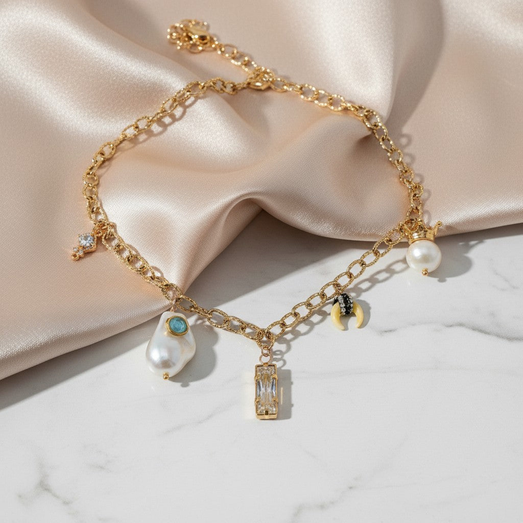 elephantina.gr gold chain necklace with baroque pearl, aquamarine, crystal, shell, and strawberry charms