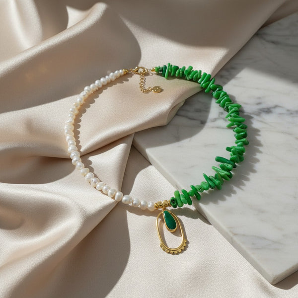 elephantina.gr asymmetrical necklace with pearls, green coral, and oval gold pendant with green enamel
