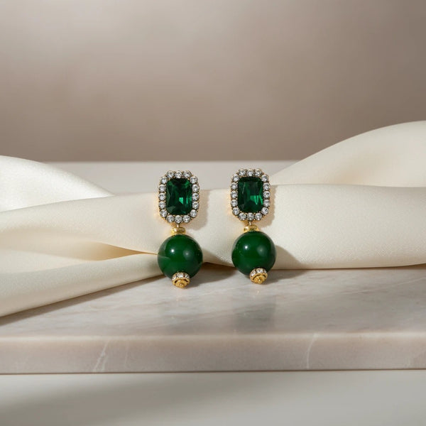 Elephantina.gr emerald cut gemstone drop earrings with crystal accents and green bead.