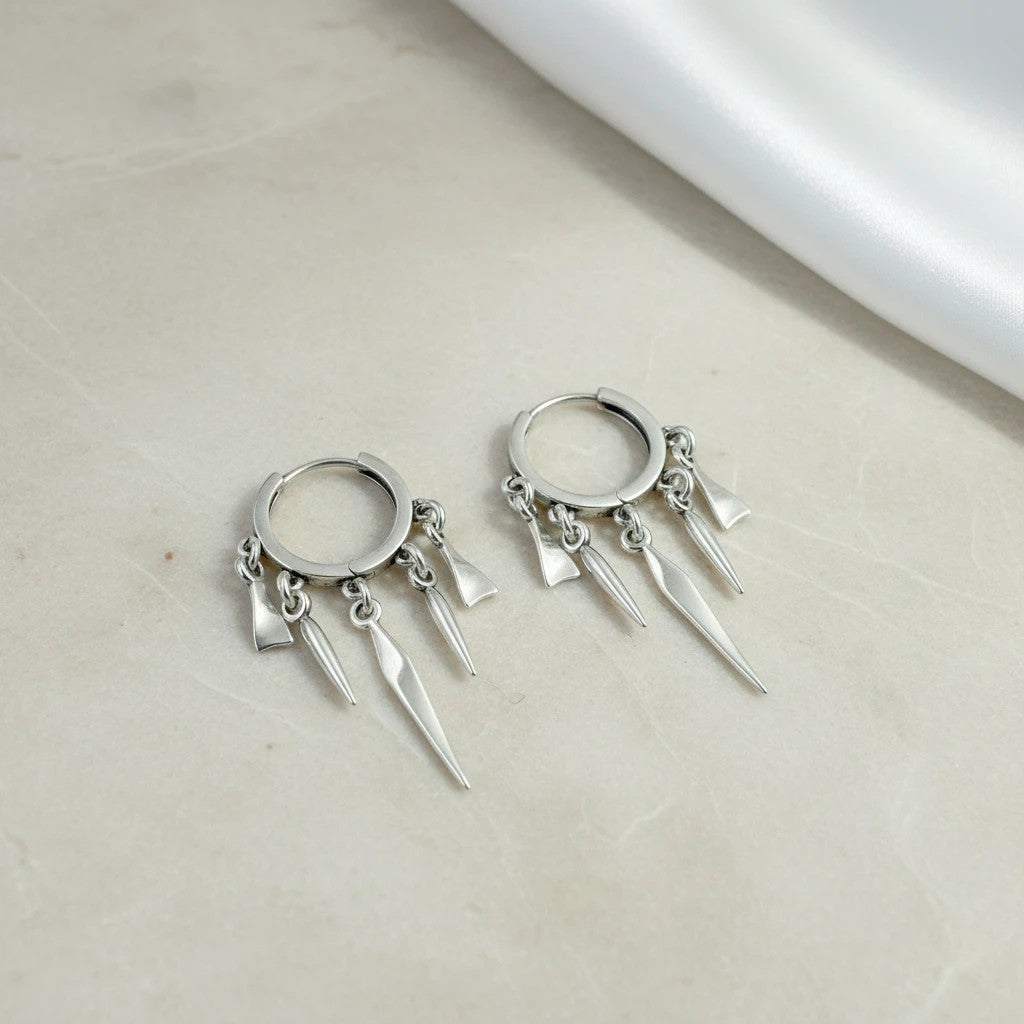 elephantina.gr silver hoop earrings with dangling spikes, 3cm length. Modern, dynamic design.