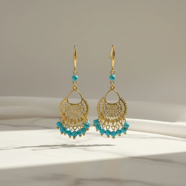 Elephantina.gr gold-plated brass boho earrings with turquoise beads and intricate filigree design. 7cm length.