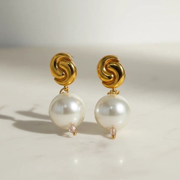 Elephantina.gr gold-tone swirl earrings with large grey pearls and pink crystal accents.