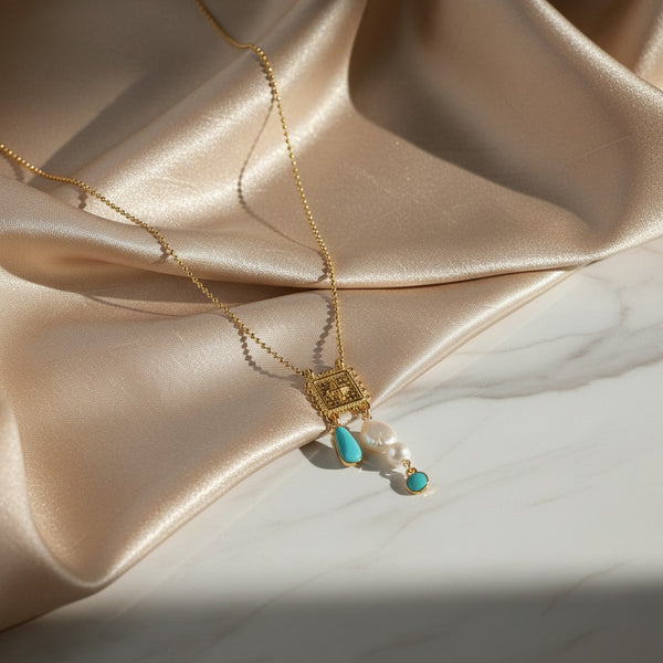 Elephantina.gr gold square pendant necklace with cross, pearls, turquoise, and white beads. 70cm chain.