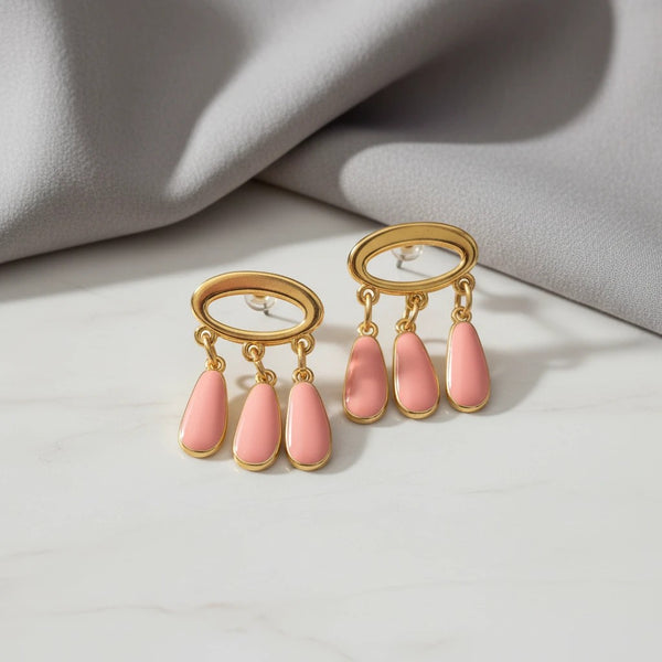 elephantina.gr handmade gold oval earrings with dangling peach enamel teardrops. Stud backing.