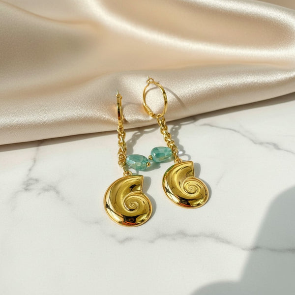 elephantina.gr gold hoop earrings with seashell charms and green crystal beads for a boho chic summer style.