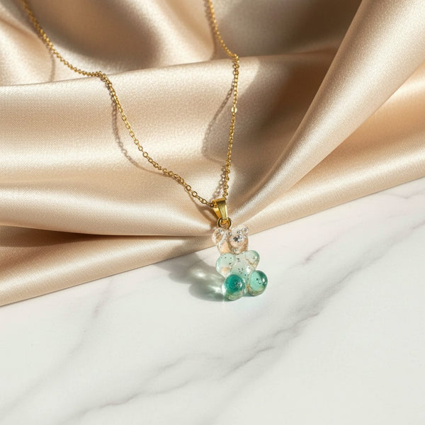 elephantina.gr necklace with steel chain and pink turquoise gradient acrylic bear pendant with glitter accents