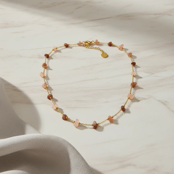 elephantina.gr gold chain necklace with scattered pink and brown gemstone chips and adjustable clasp
