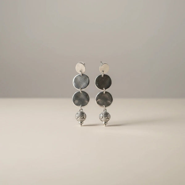 elephantina.gr silver-tone hammered disc and bead dangle earrings with post backings.