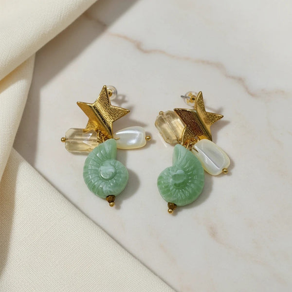 Gold Star Shell Charm Dangle Earrings by elephantina.gr featuring green ammonite fossil charms, pearl beads, and crystals.