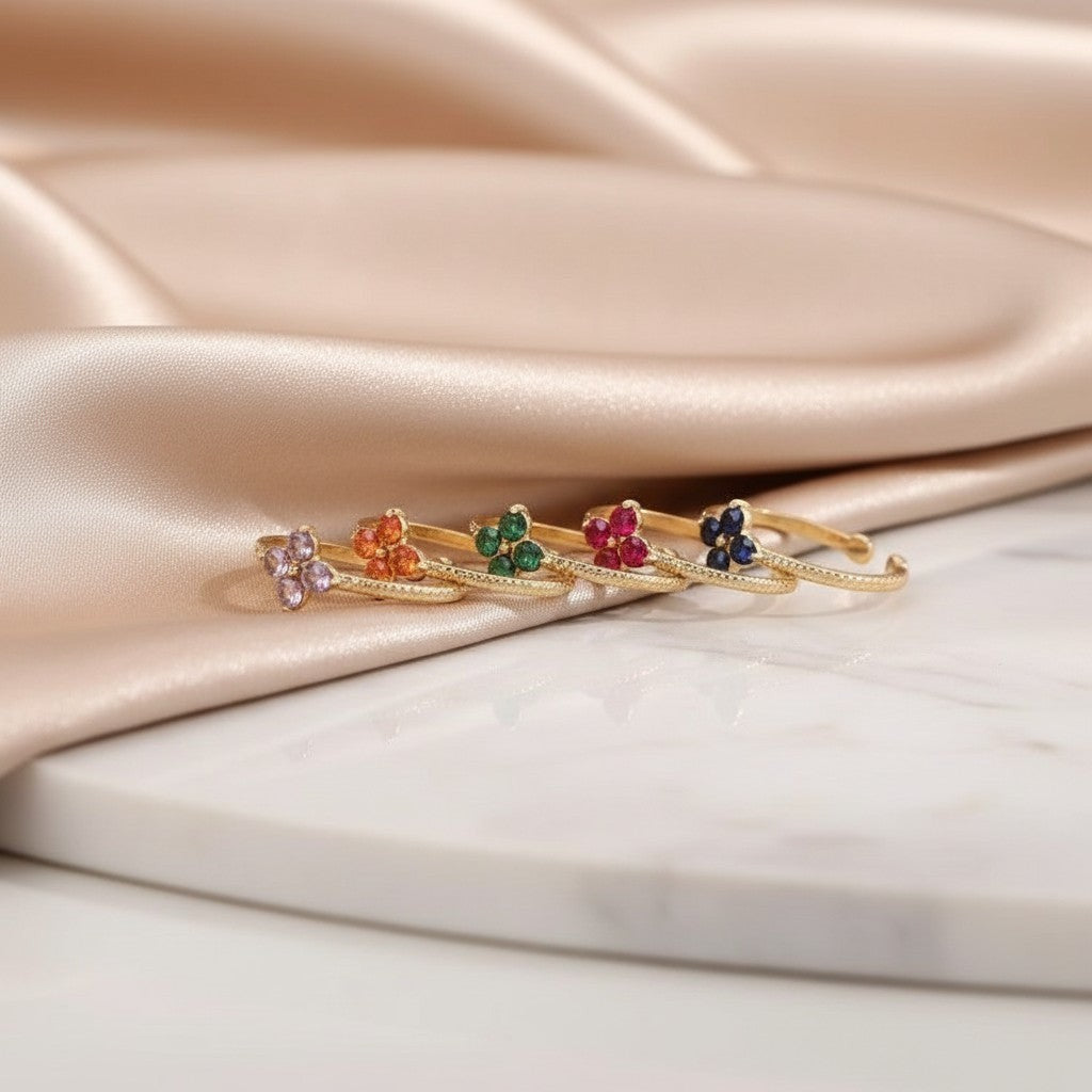 Elephantina.gr gold-plated steel ring with flower design and colorful zircon stones in lilac, orange, green, fuchsia, and blue.