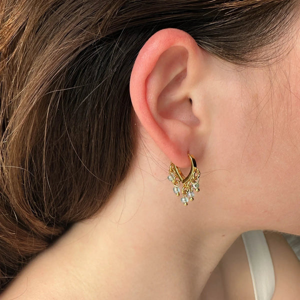 Gold plated hoop earrings with pale blue dangle beads from elephantina.gr. Bohemian style.