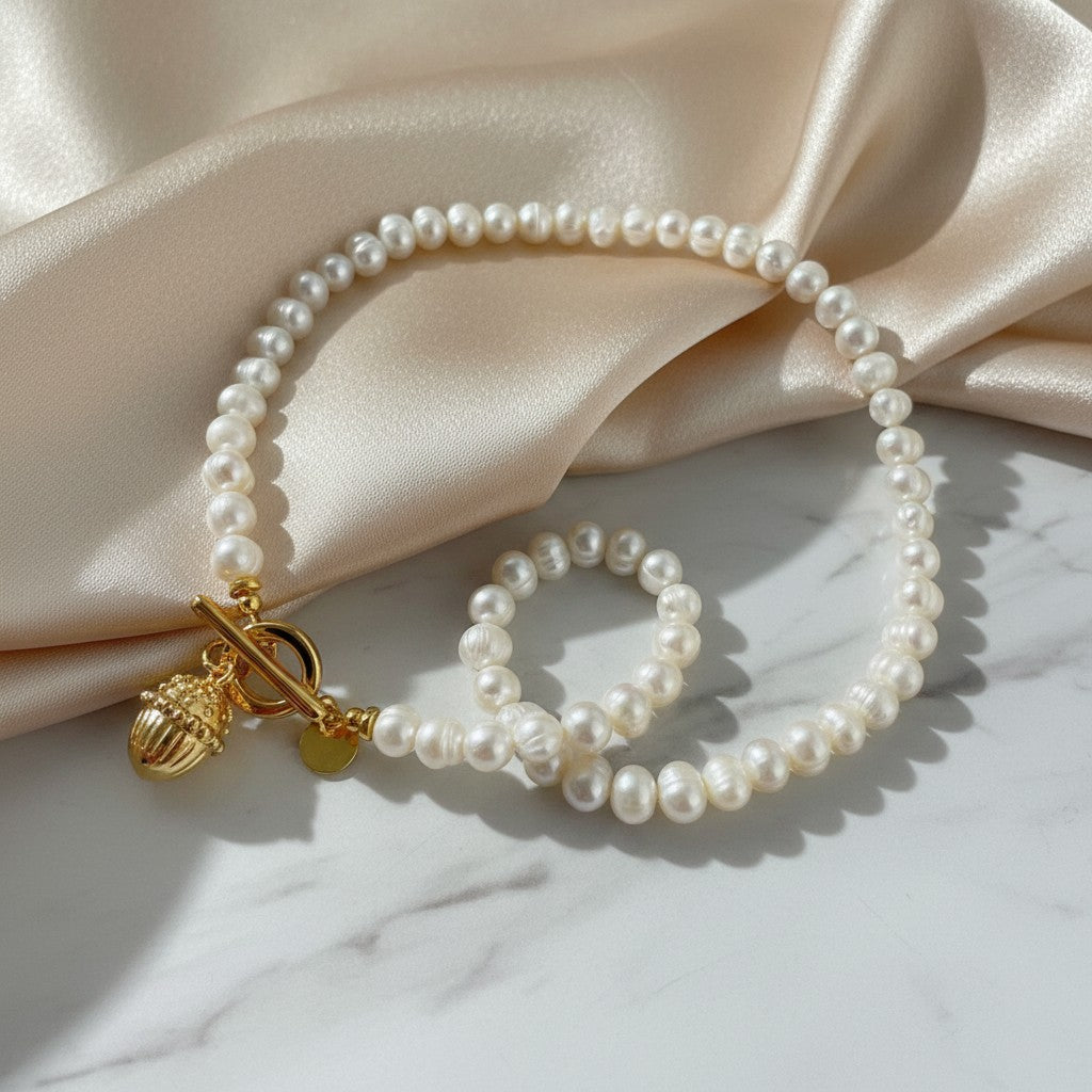 elephantina.gr cultured pearl necklace with gold T-bar clasp and acorn charm, 45cm length