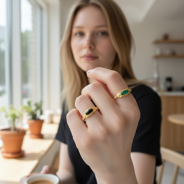 Elephantina.gr gold-plated steel ring with oval black or green stone and side zircon accents. Adjustable.