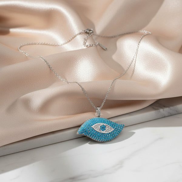 Elephantina.gr evil eye pendant necklace with turquoise stones and cubic zirconia accents on a silver-tone chain.